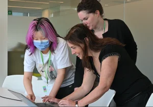 Three researchers sharing knowledge at CanNRT